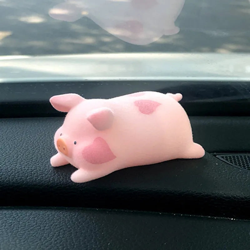 Resin cartoon pig figurine car decoration accessory on a car dashboard