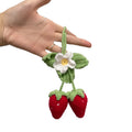 Handmade woven strawberry pendant decoration for car or keychain with lily of the valley hook.