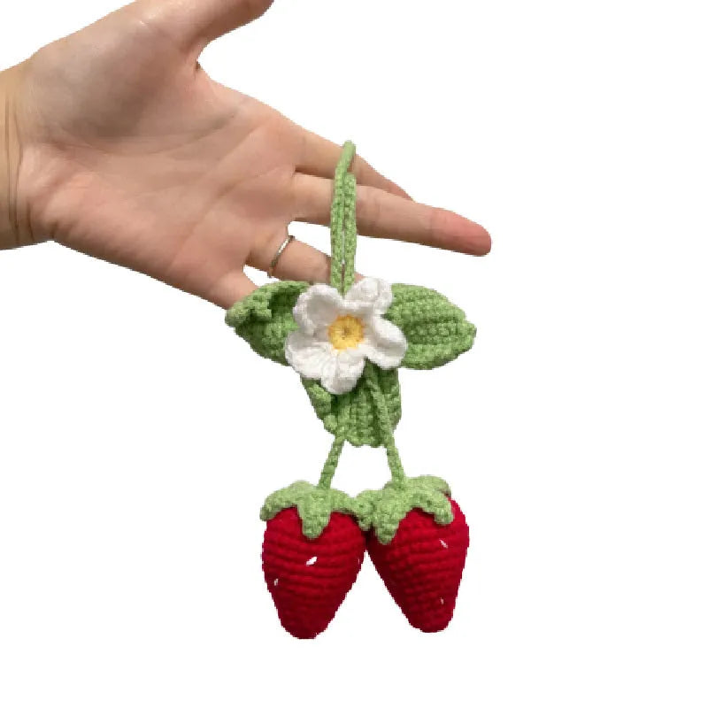 Handmade woven strawberry pendant decoration for car or keychain with lily of the valley hook.
