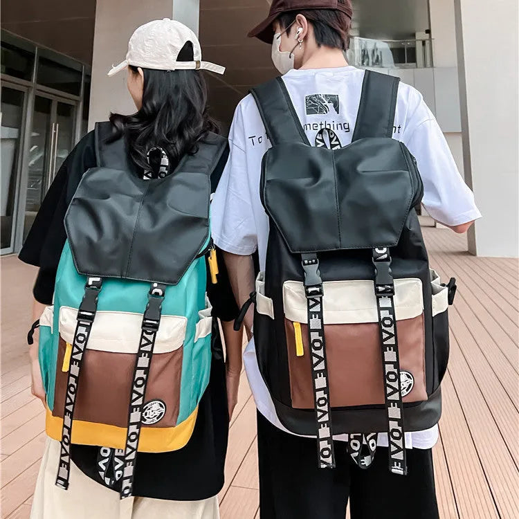 Oxford cloth backpack in black, green or red with 32cm width and 46cm height dimensions