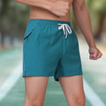 Men's black polyester micro-elastic training shorts with high waist and drawstring closure for running and sports
