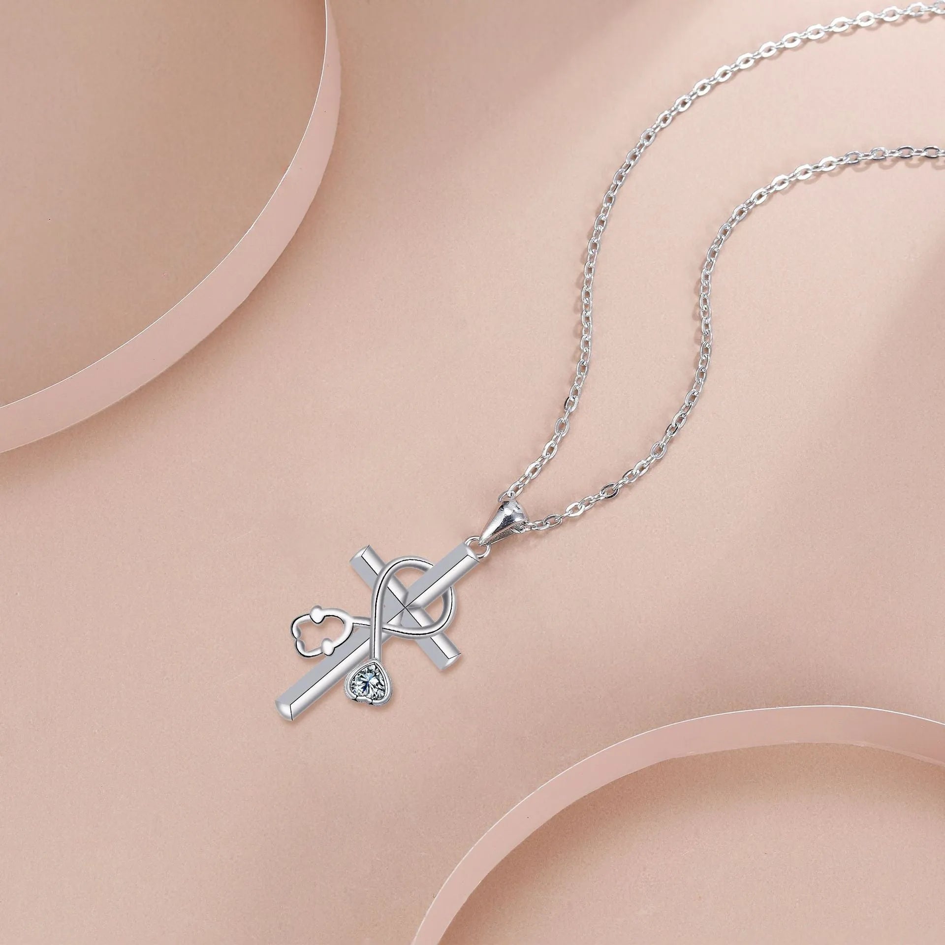Women's stethoscope necklace with cross pendant made from electroplated copper on cross chain