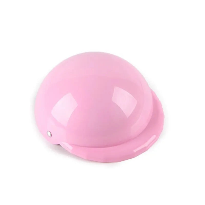 A pink plastic dog helmet cap showing its rigid shape and solid colour, sized for a small dog.