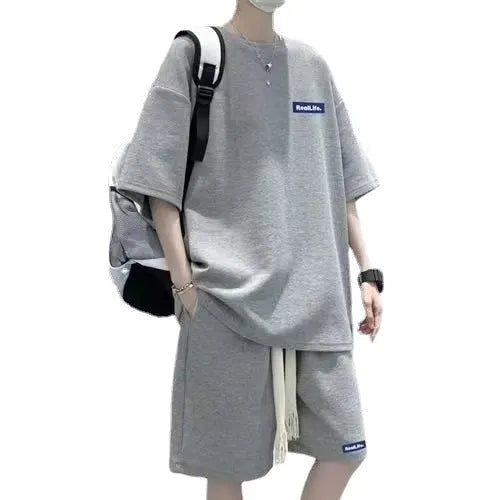 Waffle texture leisure sports suit set showing short sleeve top and matching shorts in polyester-cotton blend