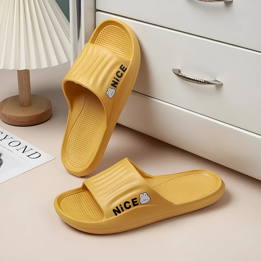 Cartoon pattern EVA slippers in various colours showing flip-flop style with non-slip soles