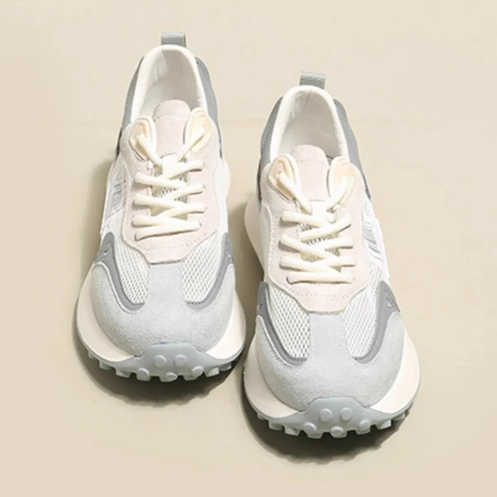 Women's grey and pink retro sneakers with low top design and rubber sole
