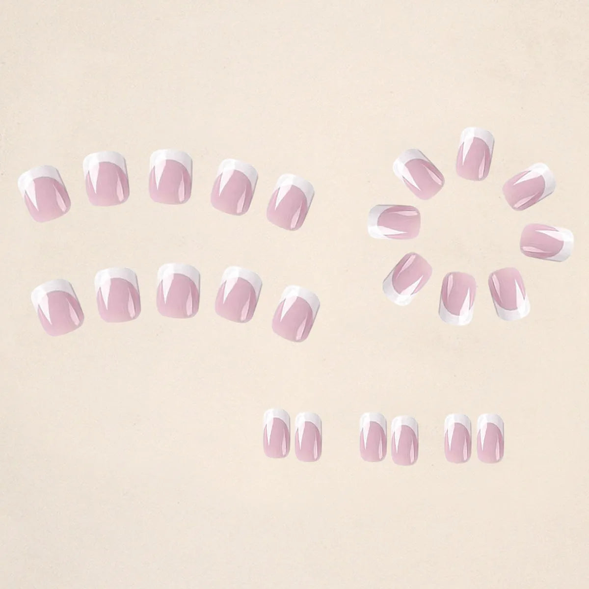 24 white false nail tips with a black and white plaid pattern, arranged on a card.