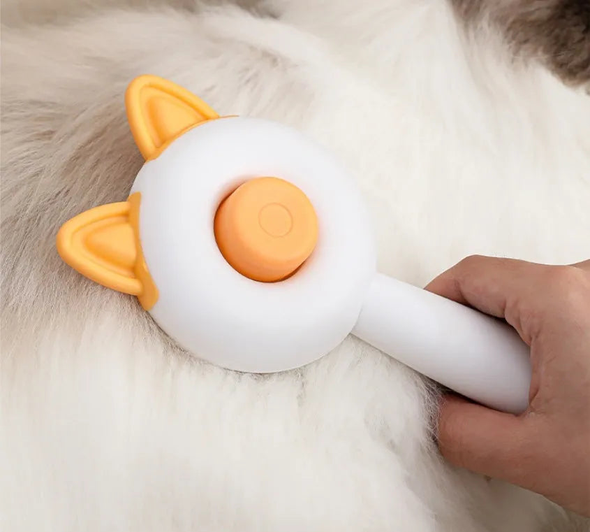 Self-cleaning cat grooming brush with stainless steel teeth in greenish white or orange white colour