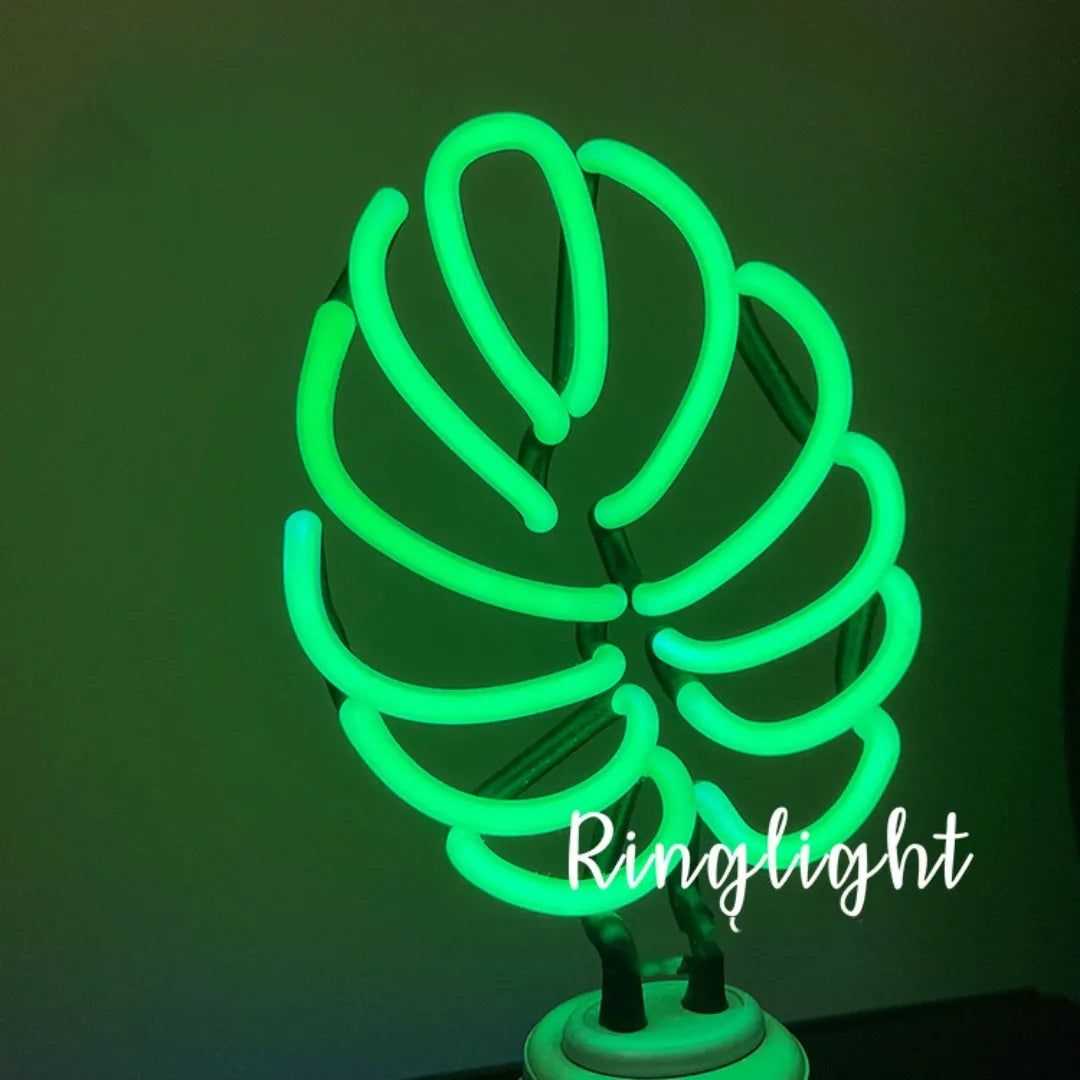 White minimalist bamboo-shaped desk lamp with green glow, showing USB cable and two size options.