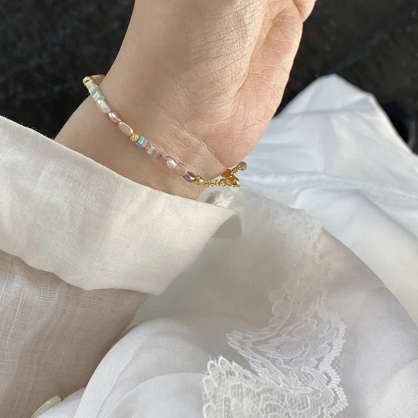 Women's 14K gilded purple silver natural pearl bracelet and necklace set showing irregular mini pearls