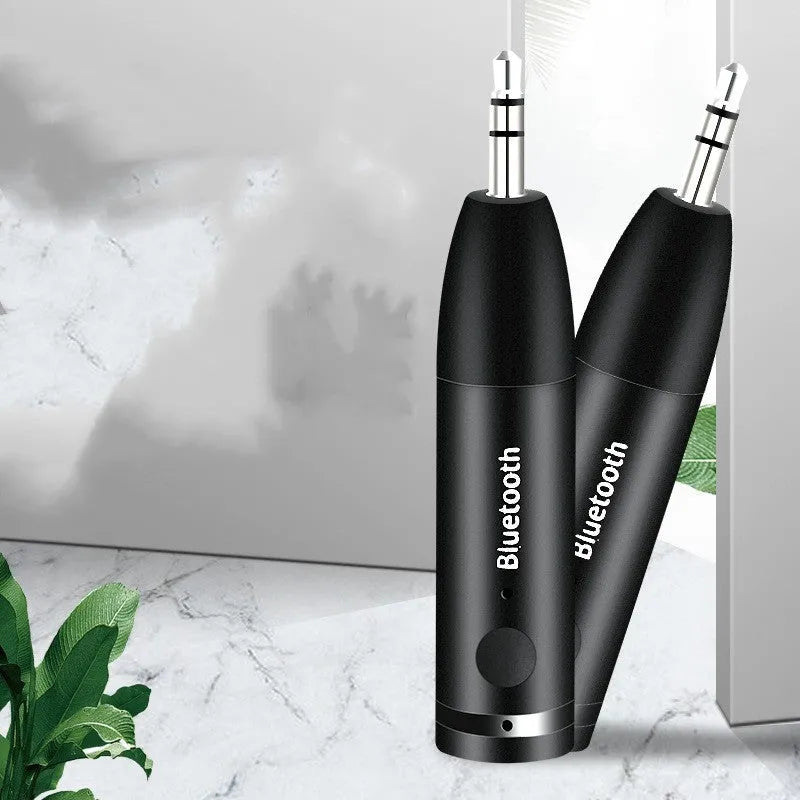 Black Bluetooth audio receiver for car AUX input with USB charging cable
