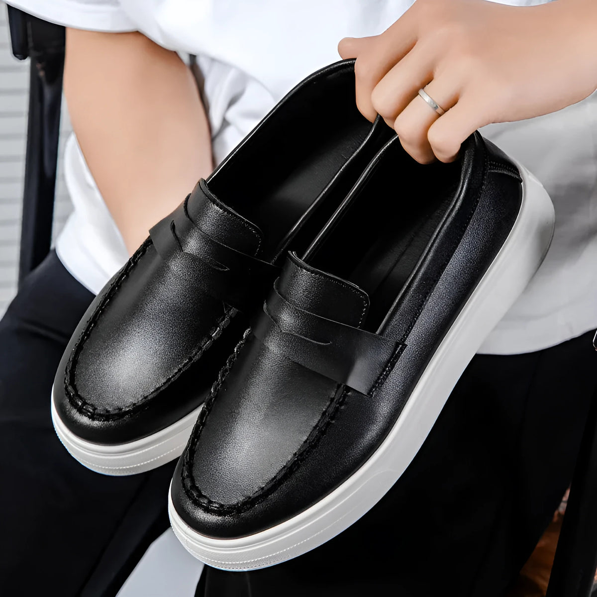 Men's casual slip-on loafers in PU leather with round toe, shown in black and white colour