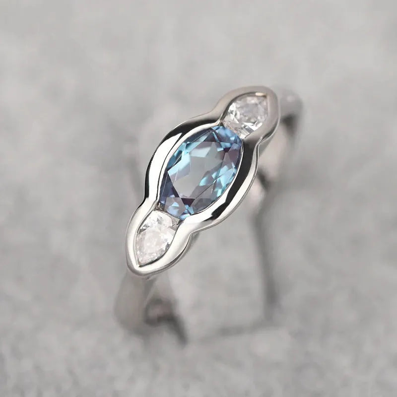 Women's geometric ellipse ring in white gold finish with inlaid zircon stones on copper