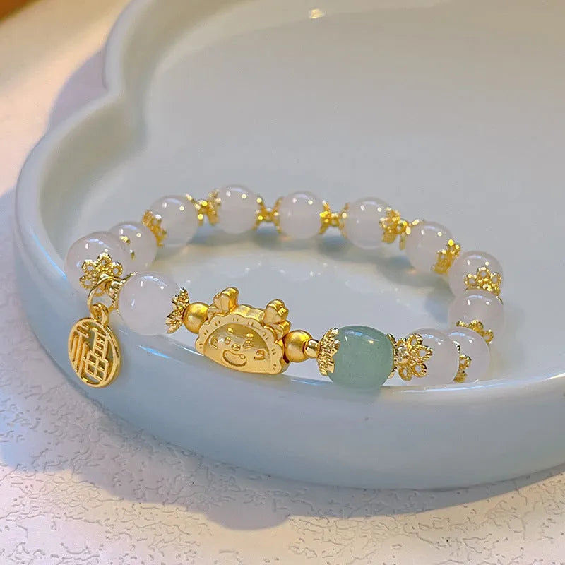 Floral glazed zodiac animal bracelet for women with coloured glass beads in red, pink, and white pearl colour variations
