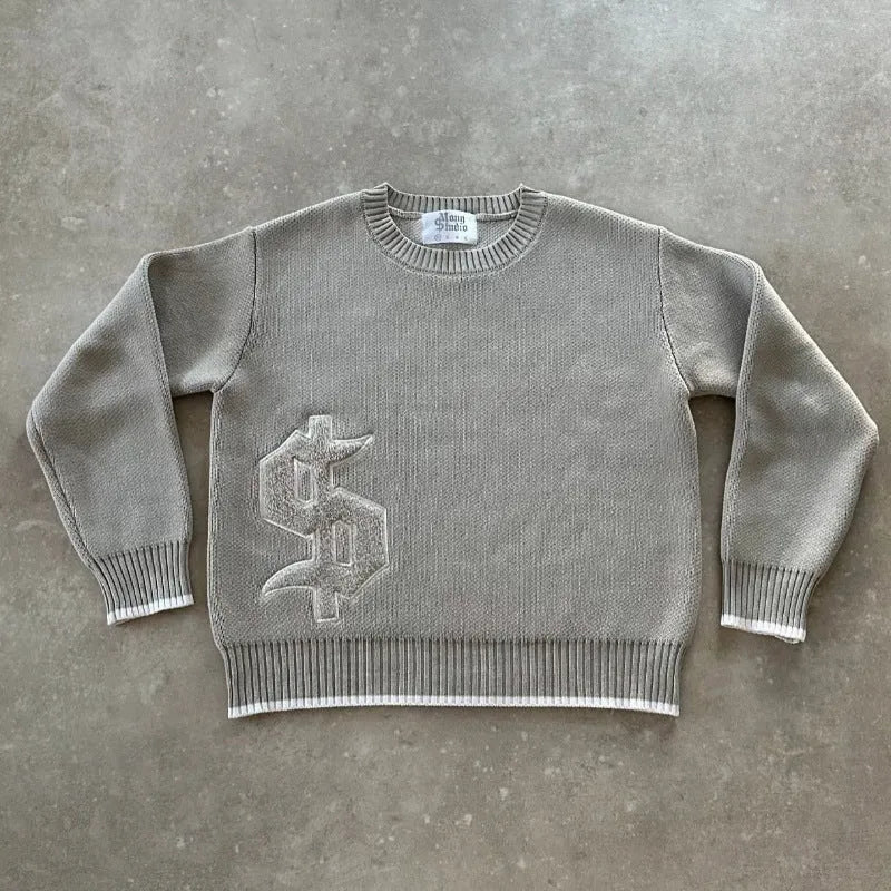 Grey loose-fitting jacquard knitwear coat with long sleeves on a hanger