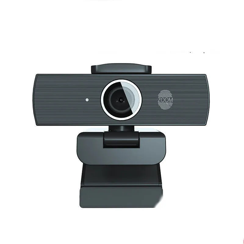 Black USB webcam with magnetic privacy cover on a laptop, showing 4K resolution and 60FPS specifications.