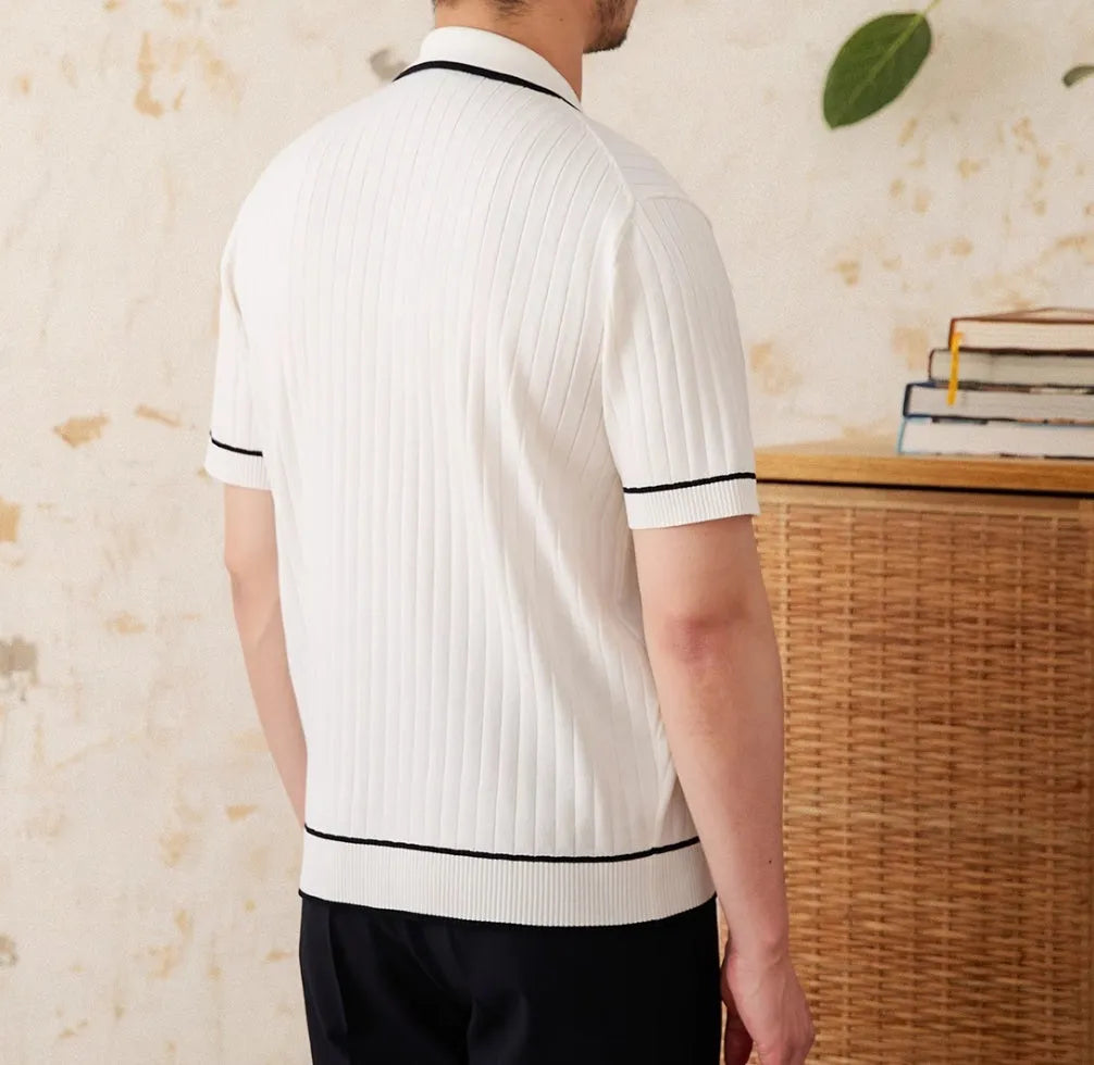 Slim black and white lapel polo shirt with short sleeves on a hanger