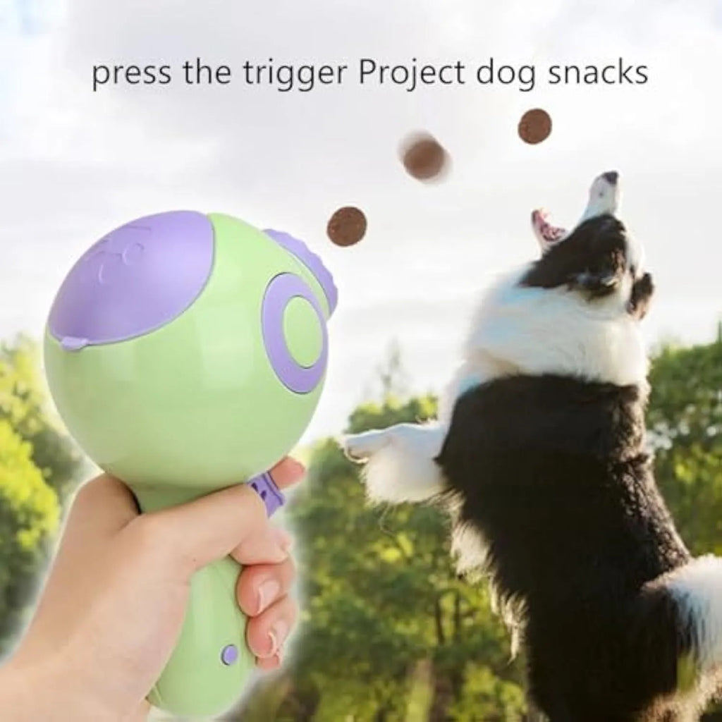 Green, orange, and pink interactive dog treat launcher toy for training and play.