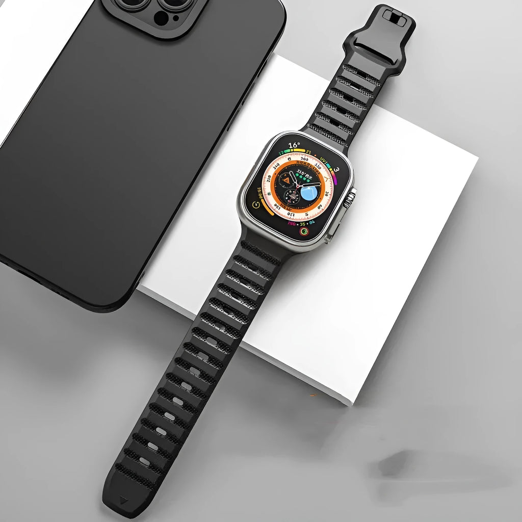 Fluoro rubber Apple Watch band in six colours with a T buckle, shown next to a smartwatch.