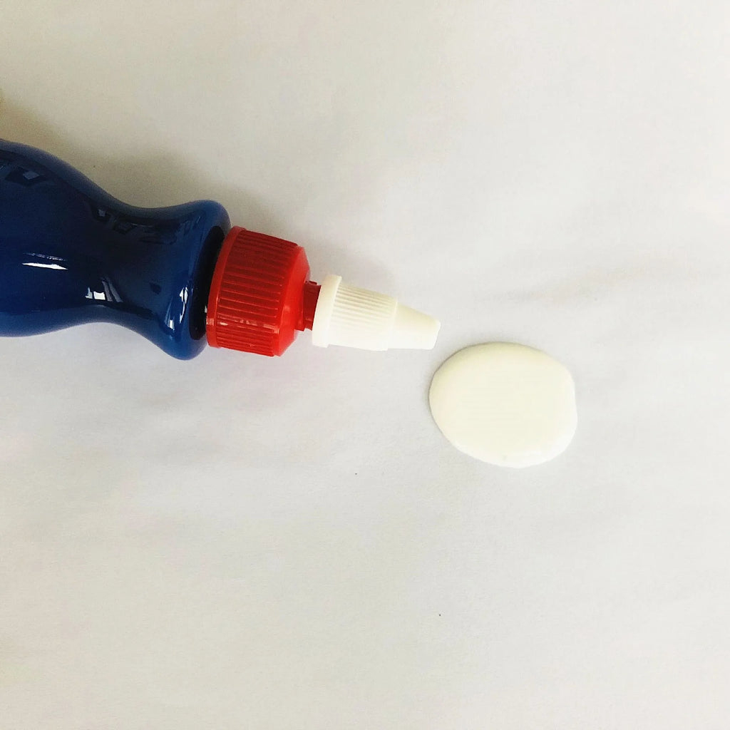 Small blue car scratch repair applicator tool with wiping sponge and repair agent bottle