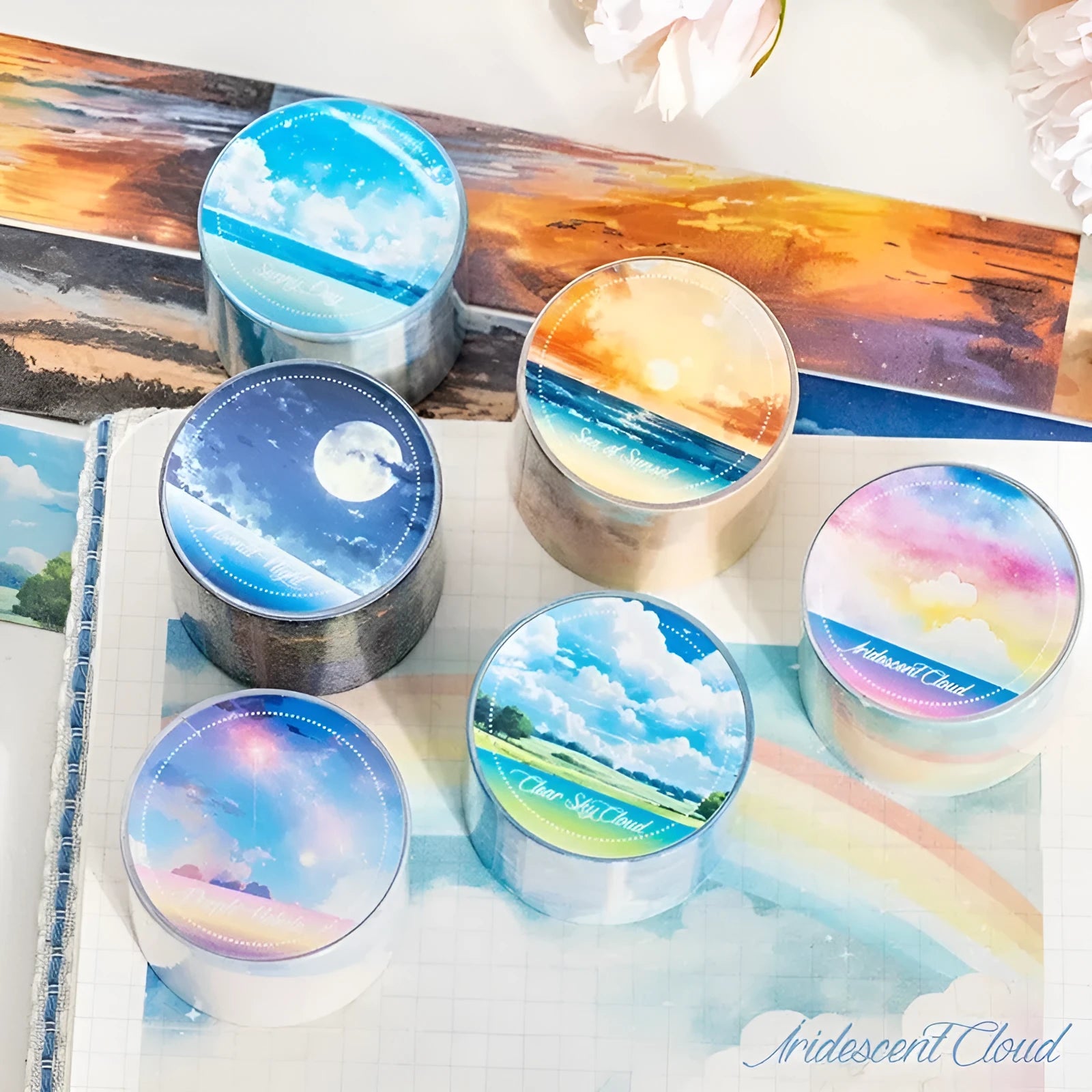 Roll of 30mm wide sky-themed Japanese paper washi tape showing colourful cloud design