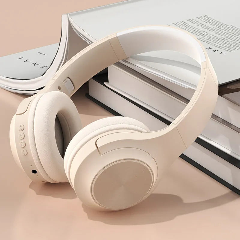 Wireless Bluetooth headset in ivory white, chalk black, or youth green colours showing head-mounted design and plastic construction