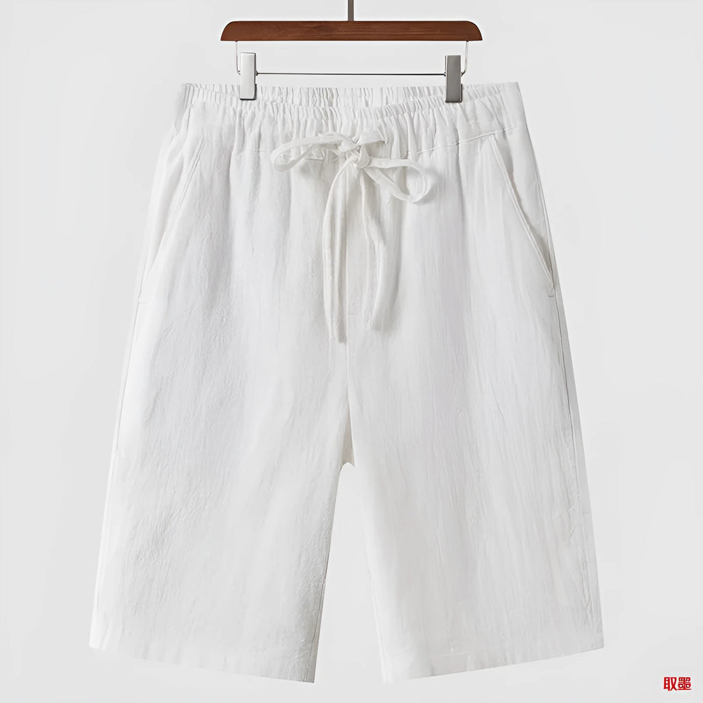 Men's loose-fit linen shorts in cropped length with elastic waistband