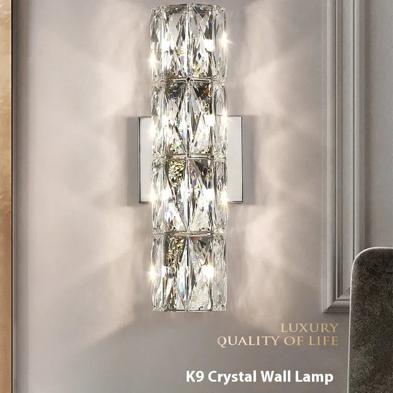 Crystal shade wall lamp with stainless steel body in chrome or gold finish, shown in multiple sizes.