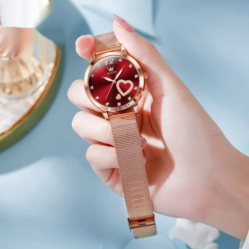 Women's fashion watch with rose shell alloy case and mesh strap showing six dial colour options