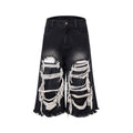 Black women's cropped wide-leg jeans with ripped patch details on a mid-high waist.
