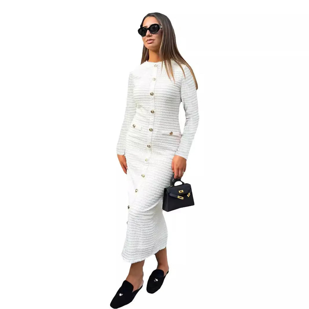 Black French retro slim fit knitted long-sleeved dress with button detail on a mannequin.