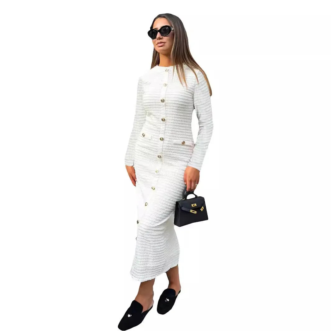 Black French retro slim fit knitted long-sleeved dress with button detail on a mannequin.