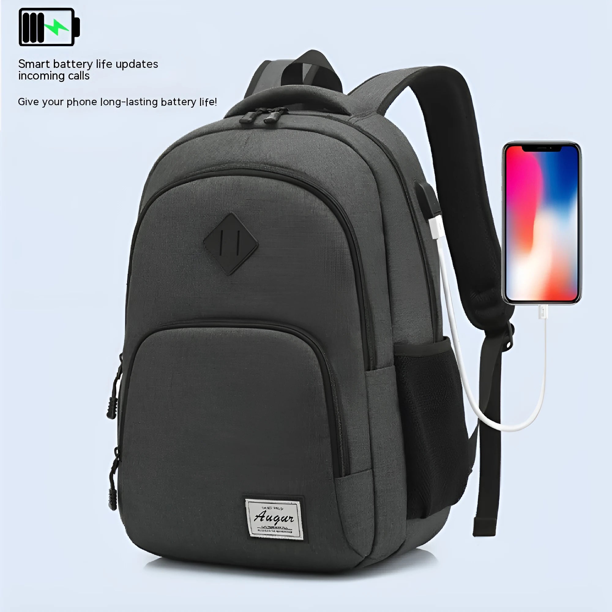 Grey lightweight nylon backpack with USB charging port shown on a trolley suitcase.