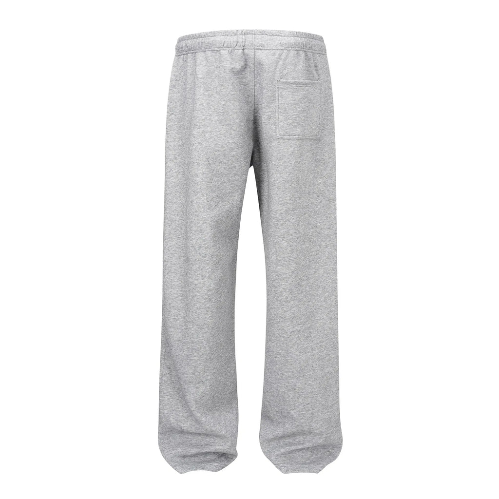Men's straight-leg casual cotton trousers in solid black colour showing loose fit design