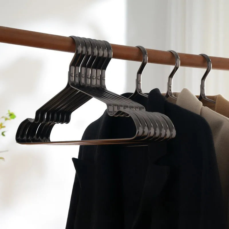 Elegant black non-slip anti-rust clothes hanger with modern minimalist design for trousers and ties.