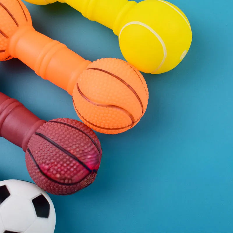 Four coloured brown, orange, white, yellow dumbbell shaped squeaky football dog toys.