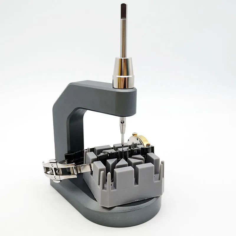 Silver-coloured press strap removal tool made from tool steel for watch and electronics repair.