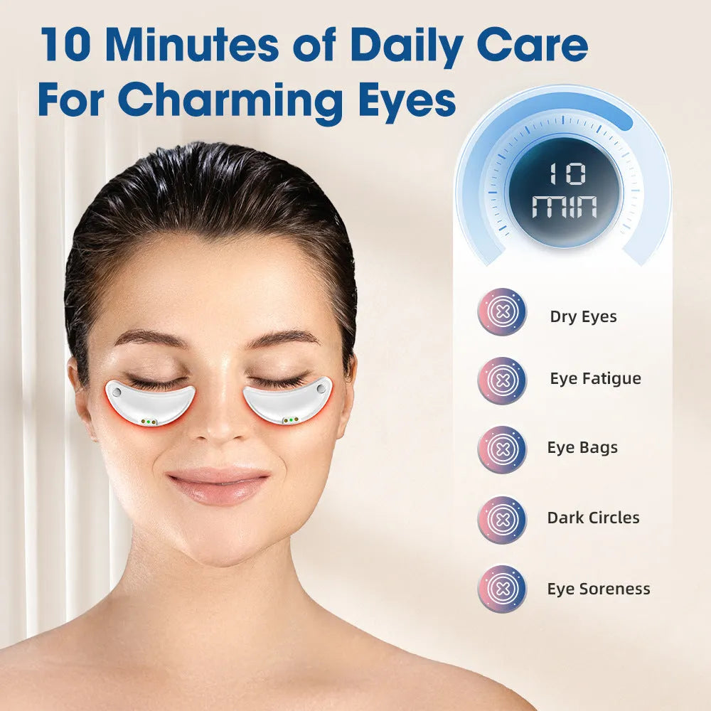 White wireless red light EMS eye and face two-in-one massage device on a table.