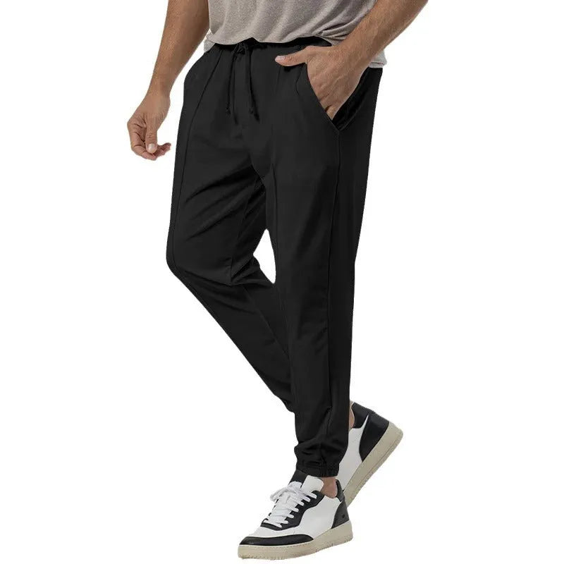 Men's gray cotton blend track sweatpants with loose tapered fit and straight-leg style