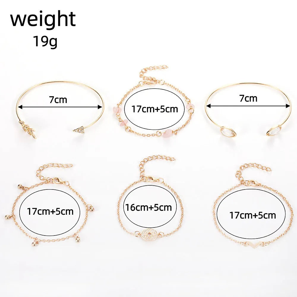 Set of six gold-coloured women's bracelets with arrow, water drop, and V-shaped pendants.