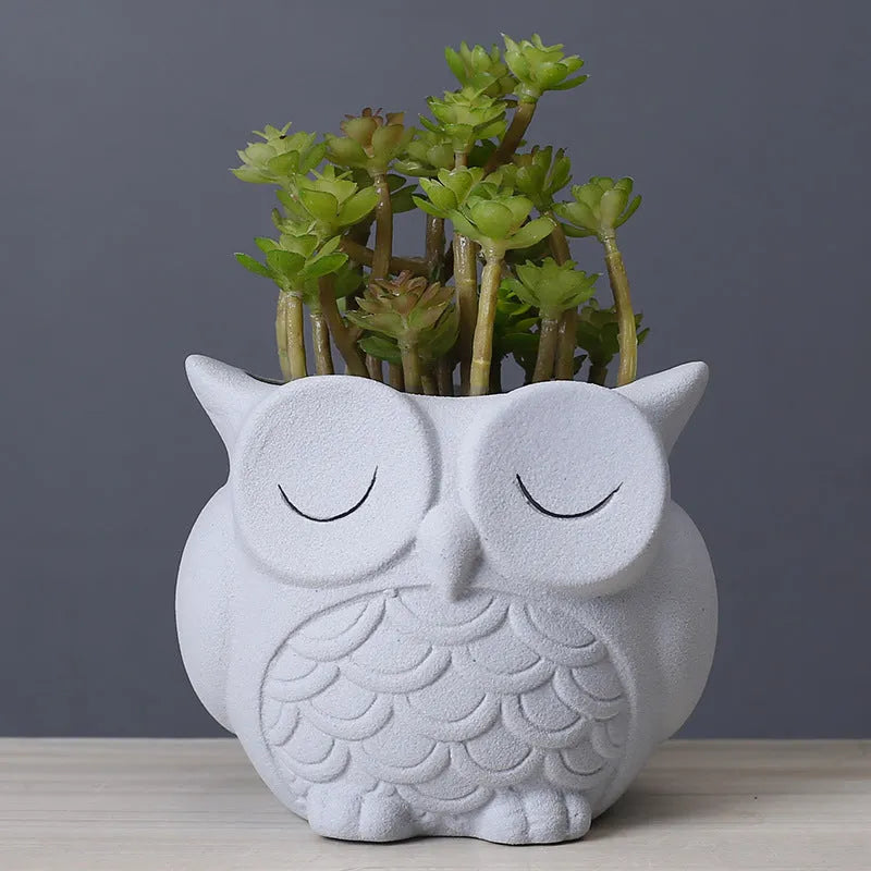 Handmade ceramic owl-design succulent pot in pastel colour measuring 11cm by 9cm by 9cm