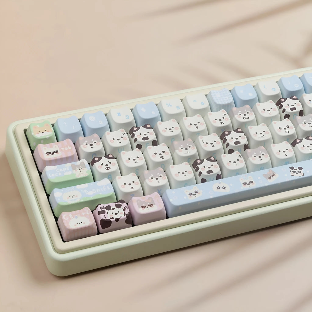 PBT sublimation keycap set showing detailed puppy and cat designs on mechanical keyboard keys