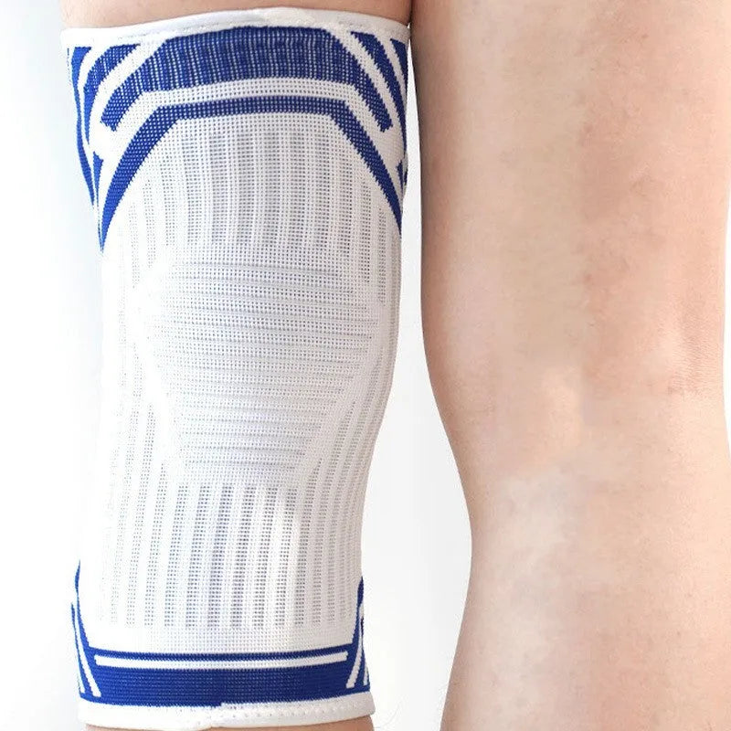 Blue high elasticity cotton knee pad for sports on an adult knee.