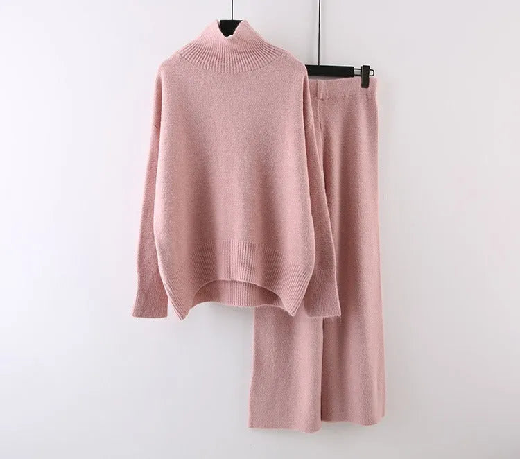 Women's beige acrylic sweater and wide-leg trousers two-piece set on a hanger