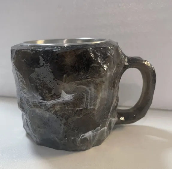 Resin mineral crystal coffee mug with handle in purple colour, showing 3D texture.
