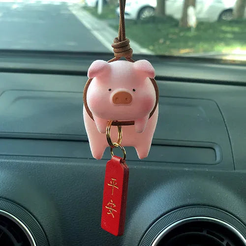 Resin cartoon pig figurine car decoration accessory on a car dashboard