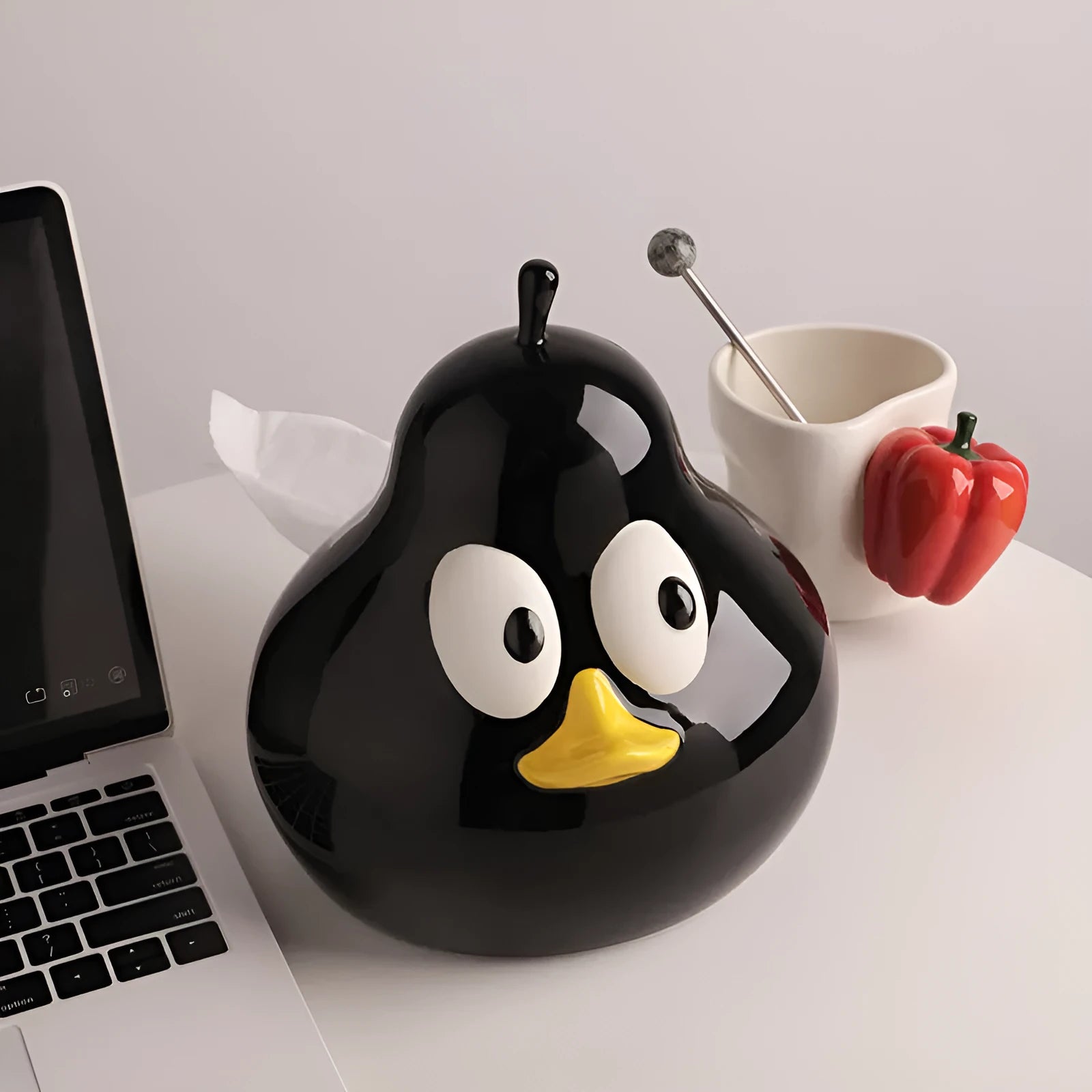 Ceramic pear-shaped tissue box with animal decoration in black or green colour