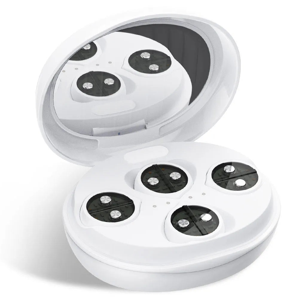 White wireless red light EMS eye and face two-in-one massage device on a table.