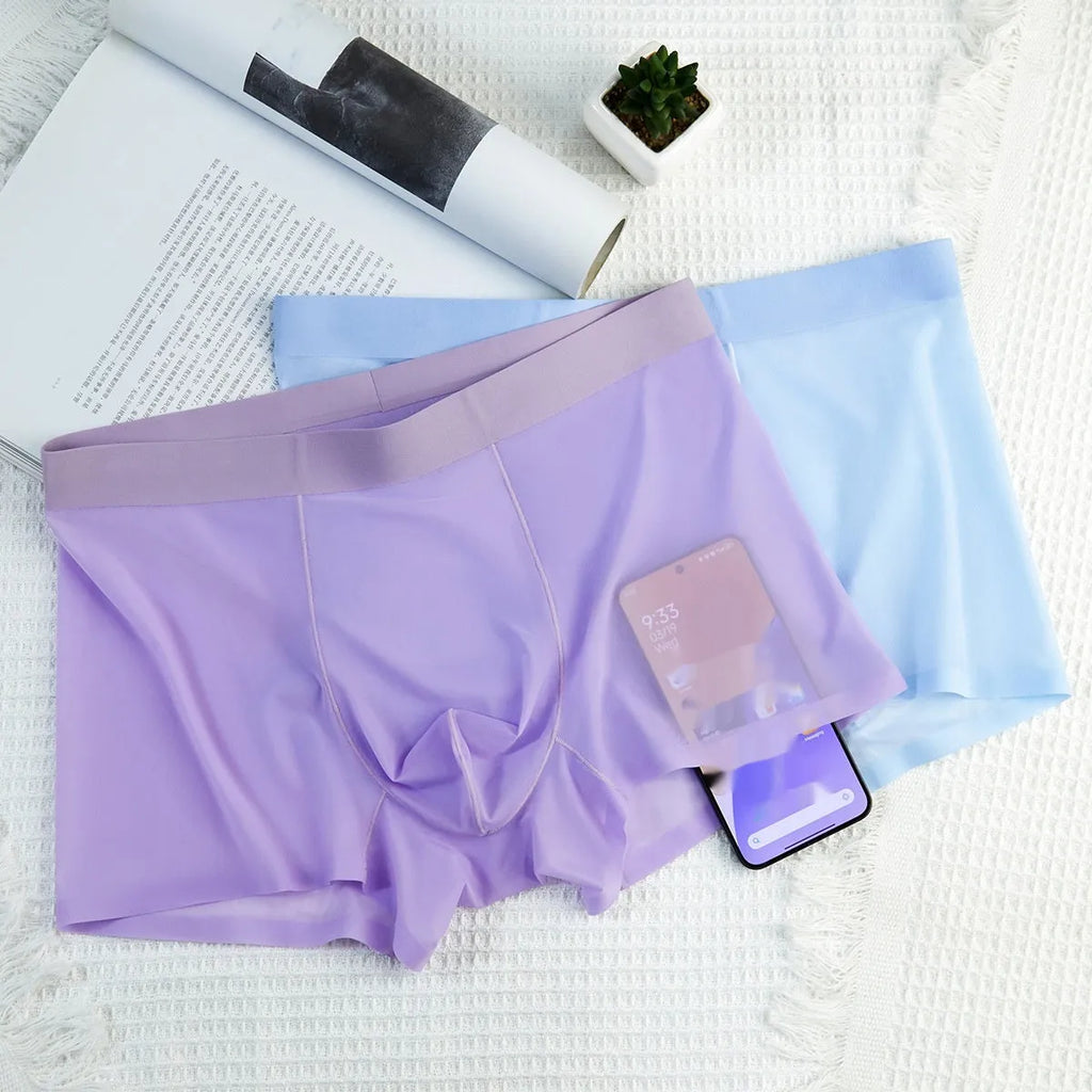 Ultra-thin white Ice Silk seamless mens boxer briefs laid flat, showing traceless design.