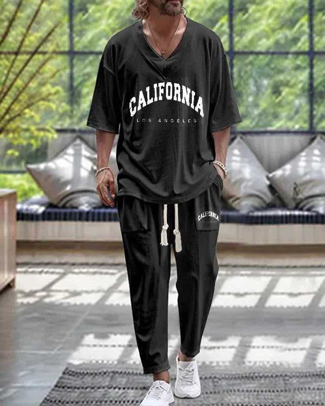 Man wearing a thin polyester V-neck trousers suit with cropped sleeves, available in multiple colours and sizes up to 6XL.